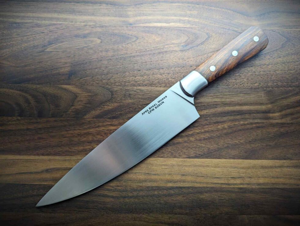 Apex Steel Works 8 inch S35VN Chef's Knife desert ironwood #002 003 showing logo side of S35VN blade and desert ironwood handle