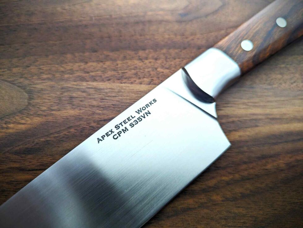 Apex Steel Works 8 inch S35VN Chef's Knife desert ironwood #002 004 showing up close Apex Steel Works logo on S35VN blade